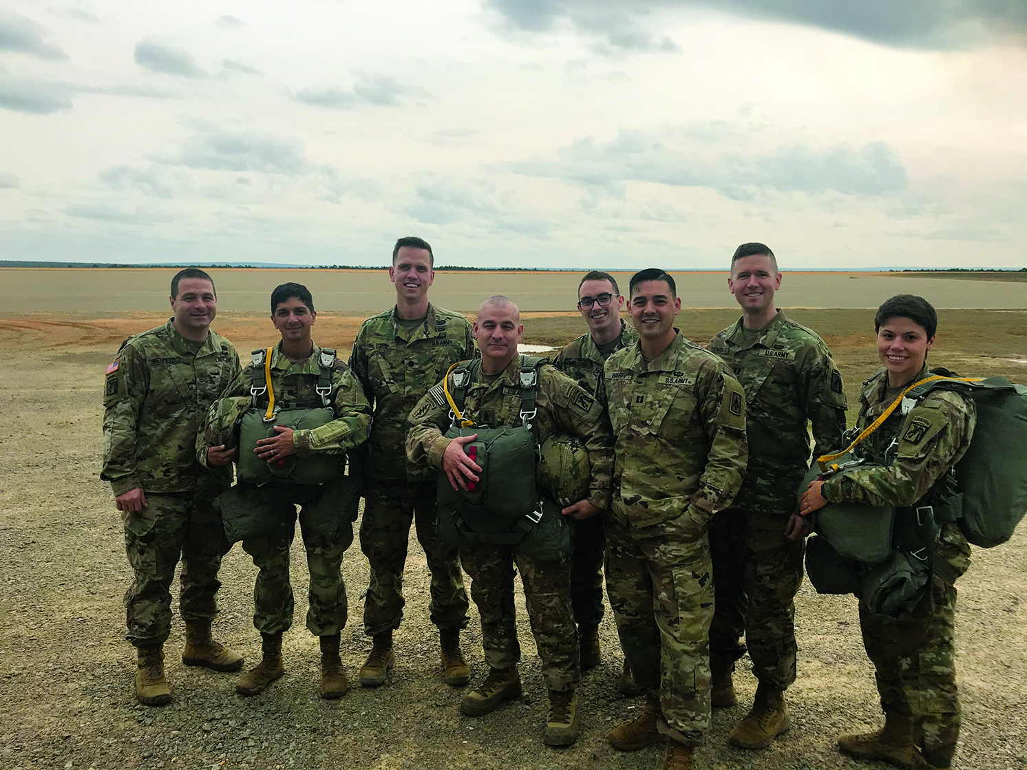 Members of the XVIII Airborne OSJA prepare for a jump. From left to right: CW3 Chris Penfield, LTC Nagy Chelluri, LTC Chris Ford, SGM Anthony Couch, SPC Nicolas Rodriguez, CPT Trevor Harris, CPT Rob Jones, CPT Jacqueline Coplen.